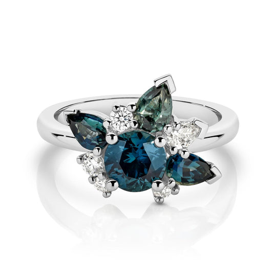 Starburst Ring with teal sapphires and natural white diamonds.