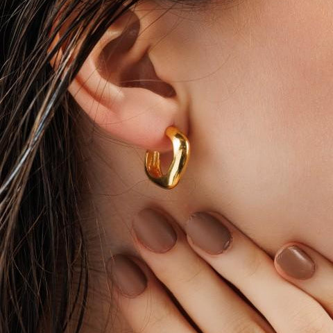 Square cushion shaped semi hoops in gold on model